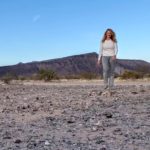 Woman walking in desert