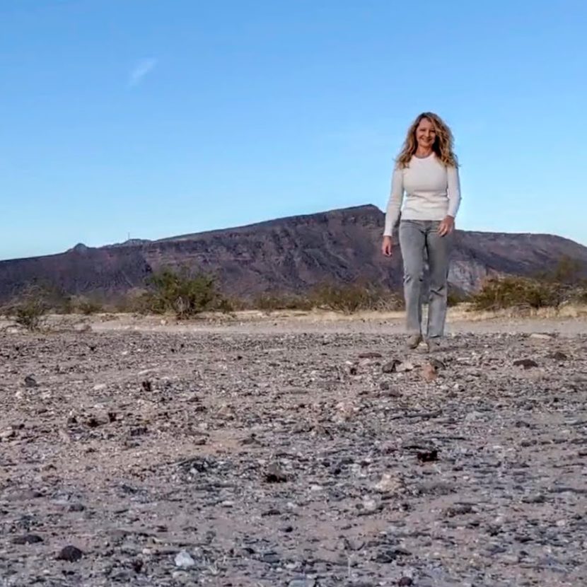 Woman walking in desert